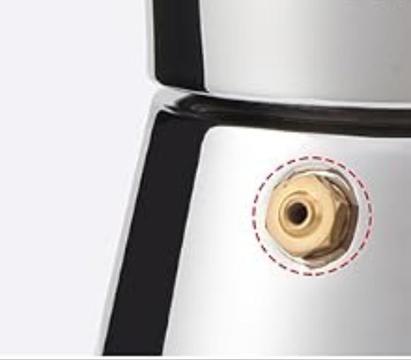 Close-up of a moka pot with a focus on the water inlet.