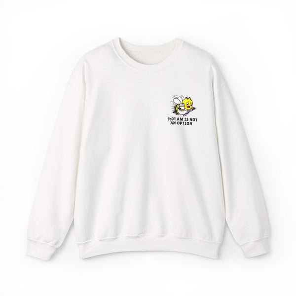 Ceramic white crewneck sweatshirt featuring a small graphic on the left chest of a rushing cartoon bee holding a coffee cup, with black text below reading "9:01 AM IS NOT AN OPTION" on a solid white background.
