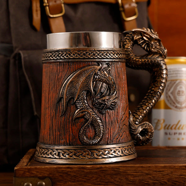 Close up of the classic bronze medieval dragon barrel tankard variant featuring a dark reddish-brown wood grain resin finish, detailed bronze dragon emblem, and braided metallic borders.