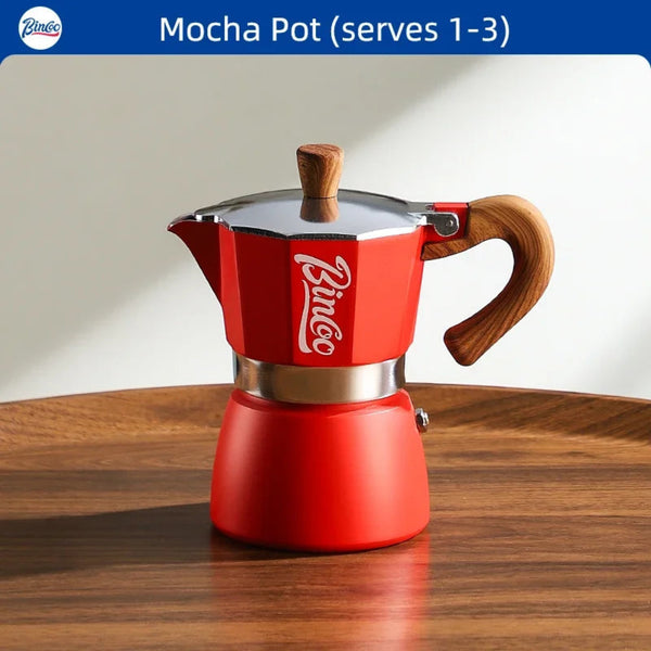 Red Bincoo Mocha Pot on a wooden surface with a white background