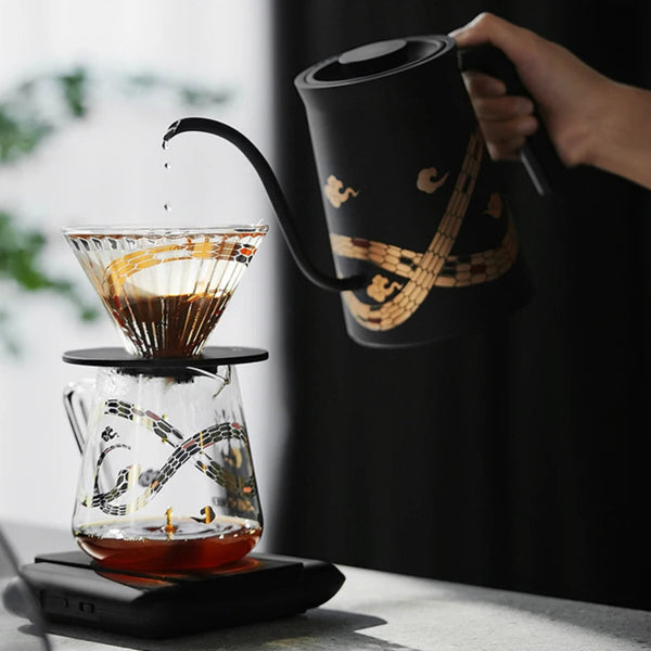 MHW-3BOMBER Serpent Series manual brew kit including the Assassin Gooseneck Kettle and 500ml Glass Server on a digital coffee scale.