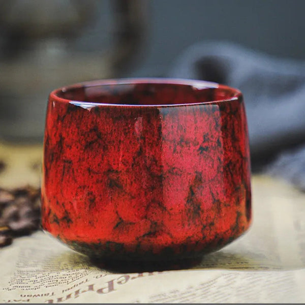 Minimalist heavy ceramic espresso cup in Amber Red with a fiery crimson and black glaze.