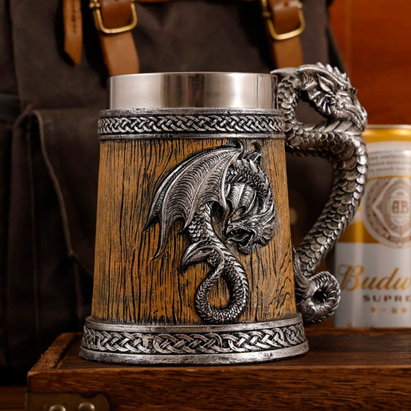 Close up of the antique silver medieval dragon barrel tankard variant featuring a light oak faux-wood textured resin finish, detailed silver dragon emblem, and intricate braided trim.