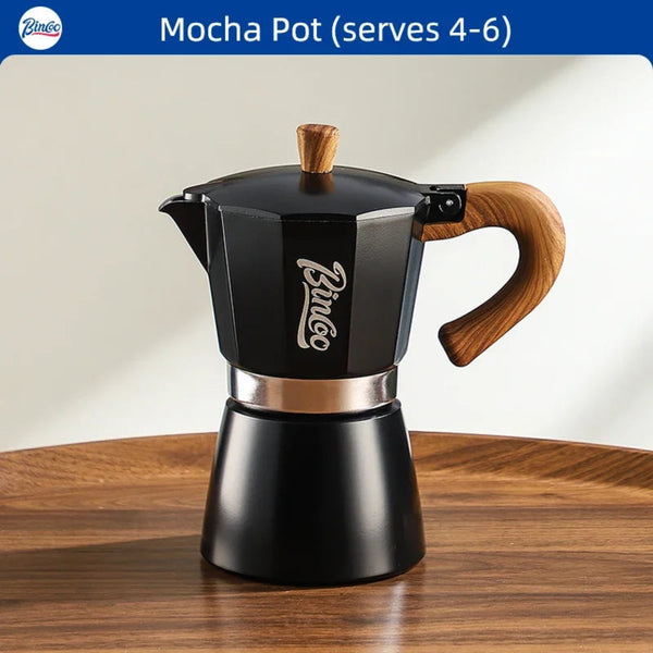 Black Bincoo mocha pot with wooden handle on a wooden surface
