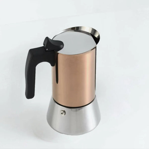Rose gold and stainless steel moka pot stovetop espresso maker with a heat-resistant black handle on a white background.