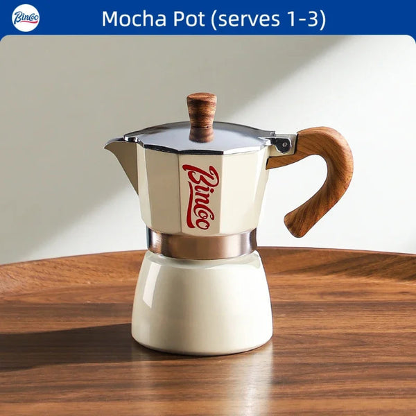Mocha pot with wooden handle and lid on a wooden table, featuring the Bincoo logo.