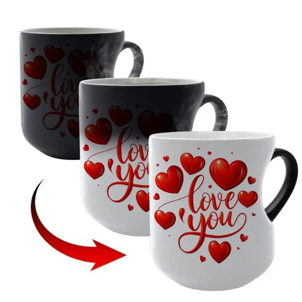 Three ceramic mugs shown to demonstrate a heat-reactive color-changing design: one black mug with red hearts and 'love you' script in the back, one partially changed mug in the middle, and one fully changed white mug with red hearts and 'love you' script in the front. A red arrow points from the back to the front to show the transformation.