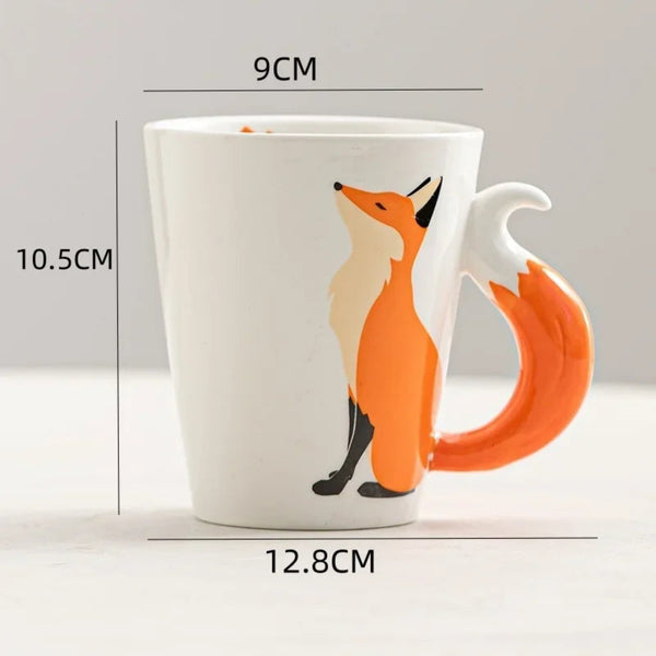 Dimensions diagram of a ceramic fox coffee mug showing a height of 10.5cm, top diameter of 9cm, and total width of 12.8cm.