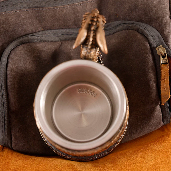 Top-down view inside the medieval dragon barrel tankard showing the clean food-grade 304 stainless steel interior liner with the authentic SUS 304 stamp at the bottom.