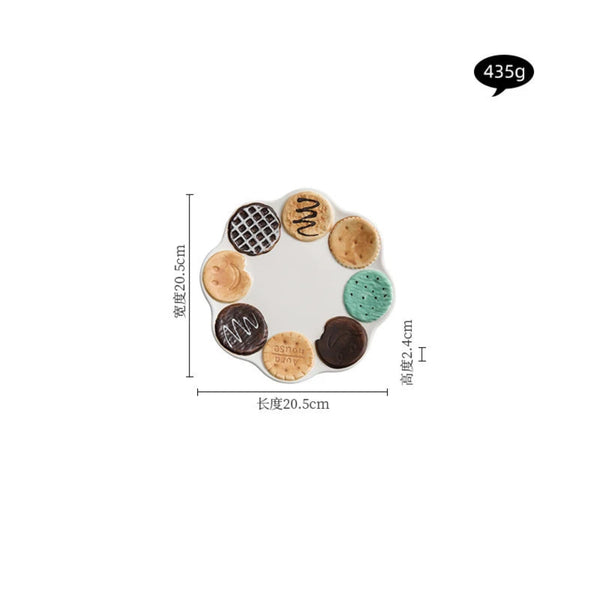 Technical dimensions for the scalloped ceramic plate with assorted 3D chocolate and mint biscuit decorations: 20.5cm diameter, 2.4cm height, and 435g weight.