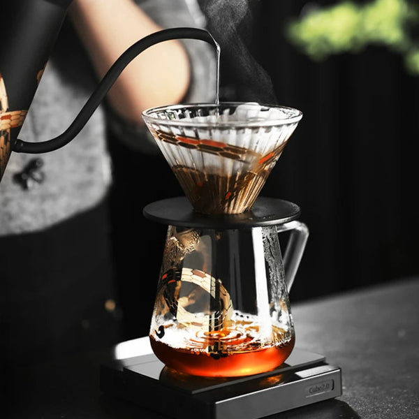 MHW-3BOMBER Serpent Series manual brew kit including the Assassin Gooseneck Kettle and 500ml Glass Server on a digital coffee scale.