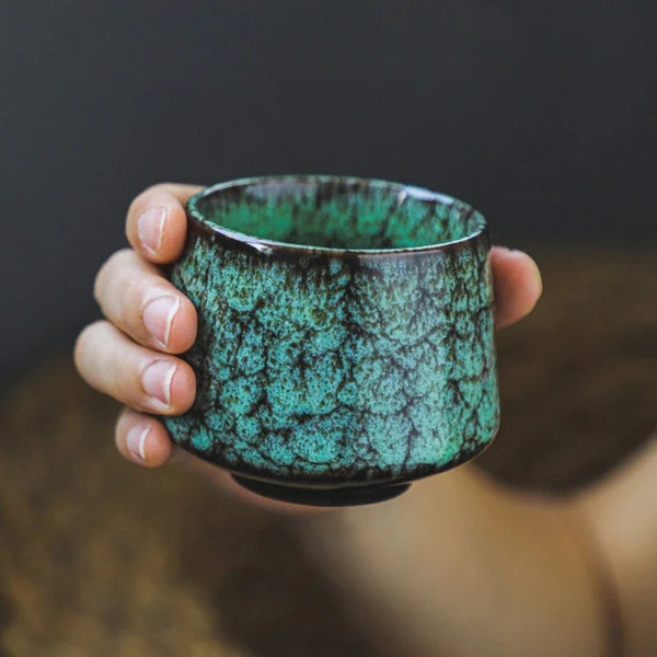 Minimalist kiln-glazed ceramic coffee cup holding 170ml flat white on a modern kitchen counter
