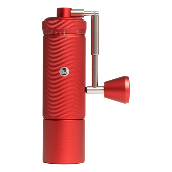 TIMEMORE Chestnut S3 Manual Coffee Grinder in Crimson Red, showcasing the textured metal unibody, external camera-lens style grind adjustment ring with numerical dial markings, and the patented spring-assisted foldable crank handle with matching red metal knob on a solid white background.