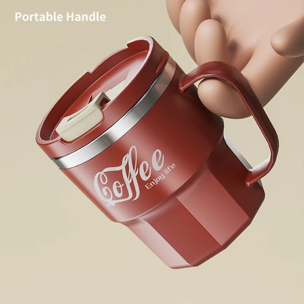 Hand holding red insulated coffee mug with comfortable portable handle and flip top lid