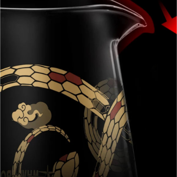 Close-up of the MHW-3BOMBER Serpent Series Coffee Server featuring an eagle-mouth spout for drip-free pouring and intricate gold snake scale patterns.
