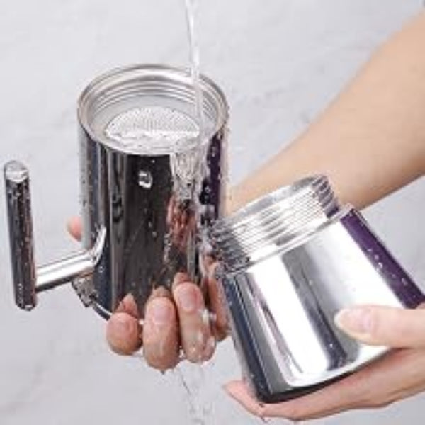 Person cleaning the moka pot.
